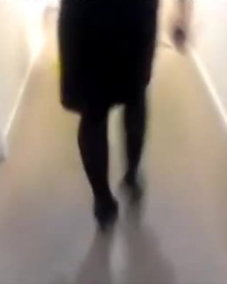 Candid Heels And Tights In Corridor