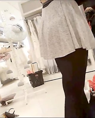 Sexy girl in mini skirt and black pantyhose upskirt