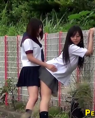 Asian teenagers outdoors urinate